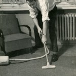 1950s man with vacuum cleaner
