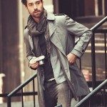 Fashionable man wearing a scarf in a fashionable manner.